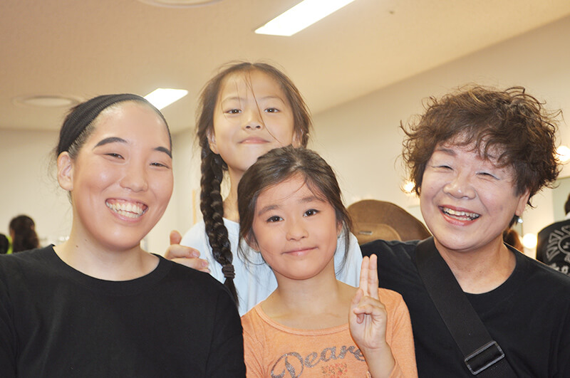 Toshiko Kigure (far right), representative of the theater company Poka Poka, and member Sato (far left)