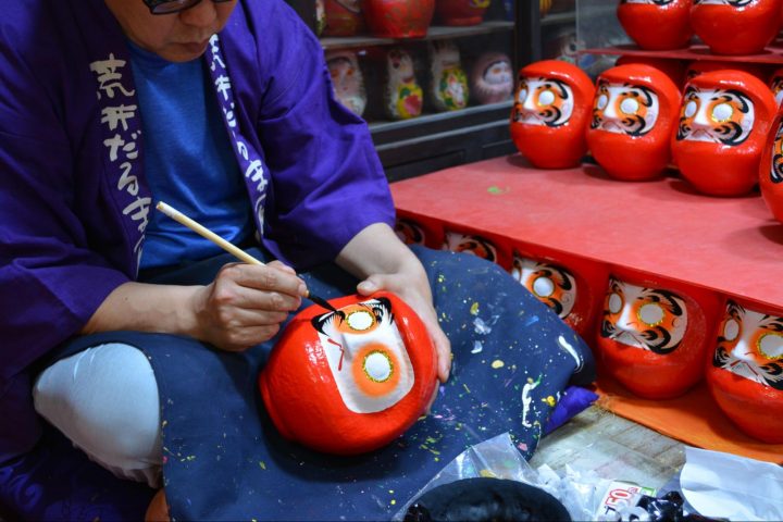 A Daruma doll being created at Arai Daruma Store