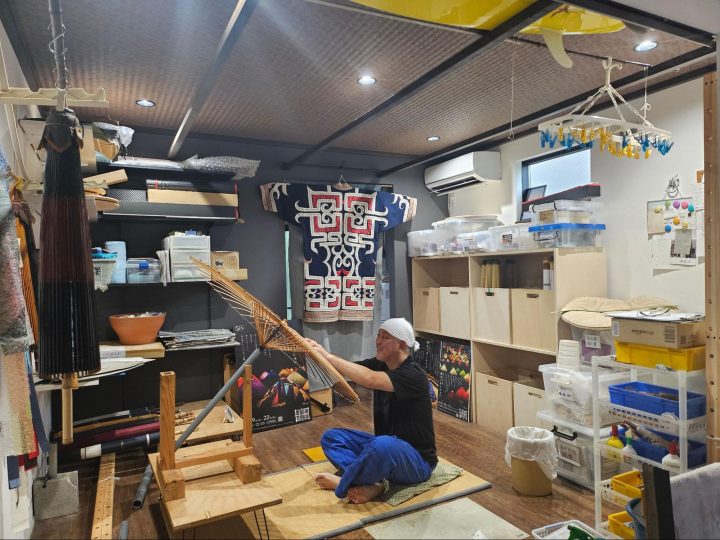 Hidenori Sugizaki is hard at work on a traditional wagasa umbrella