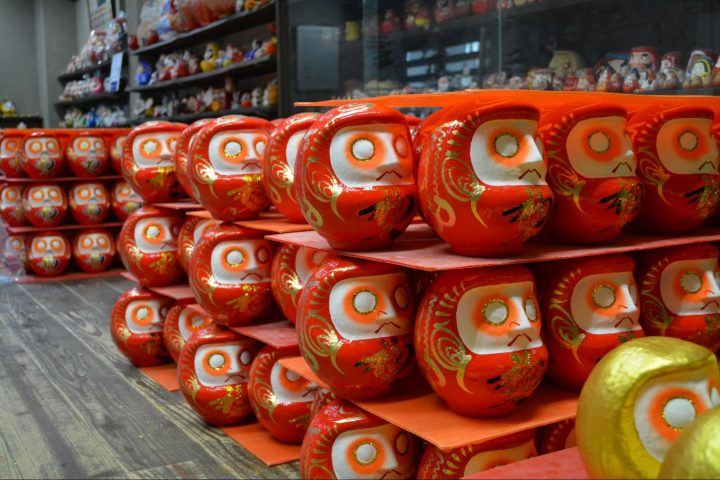 Daruma dolls lined up at Arai Daruma Store