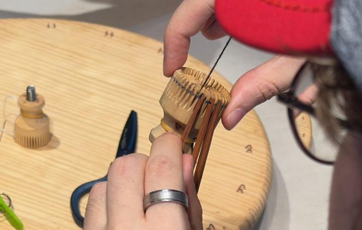 Threading the lampshade’s spokes into the wheel