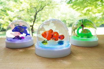 Image of Rainbow-colored glowing summer snow globe!